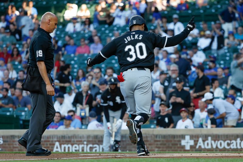 Jun 5, 2024; Chicago, Illinois, USA; Chicago White Sox outfielder Corey Julks (30) crosses home plate after hitting a solo home run against the Chicago Cubs during the first inning at Wrigley Field. Mandatory Credit: Kamil Krzaczynski-USA TODAY Sports