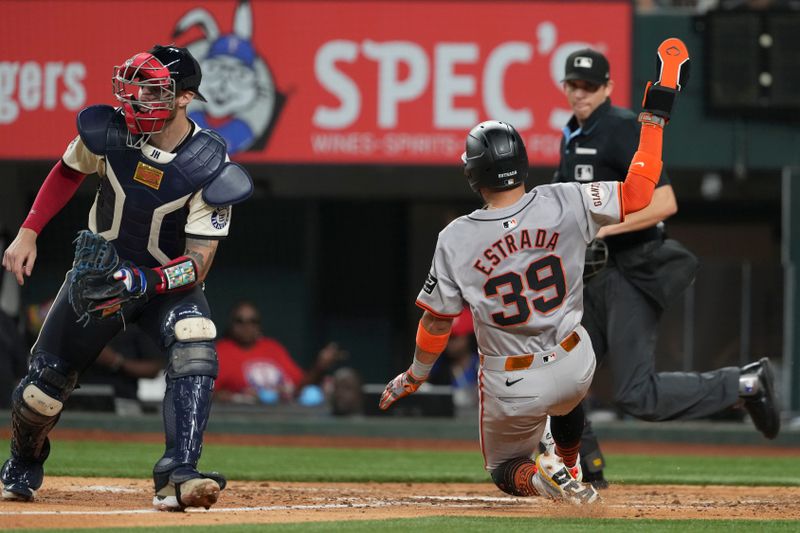 Jun 7, 2024; Arlington, Texas, USA; San Francisco Giants second baseman Thairo Estrada (39) slides to score against the Texas Rangers during the eighth inning at Globe Life Field. Mandatory Credit: Jim Cowsert-USA TODAY Sports