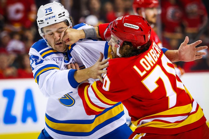Oct 11, 2025; Calgary, Alberta, CAN; Calgary Flames left wing Ryan Lomberg (70) and St. Louis Blues defenseman Tyler Tucker (75) fights during the second period at Scotiabank Saddledome. Mandatory Credit: Sergei Belski-Imagn Images
