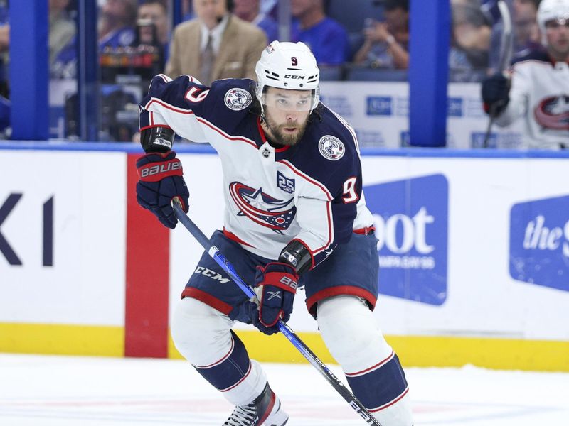Mar 10, 2026; Tampa, Florida, USA; Columbus Blue Jackets defenseman Ivan Provorov (9) controls the puck against the Tampa Bay Lightning in the second period at Benchmark International Arena. Mandatory Credit: Nathan Ray Seebeck-Imagn Images