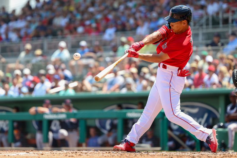 Mar 28, 2023; Fort Myers, Florida, USA;  Boston Red Sox left fielder Masataka Yoshida (7) hits a two-run home run against the Atlanta Braves in the first inning during spring training at JetBlue Park at Fenway South. Mandatory Credit: Nathan Ray Seebeck-USA TODAY Sports