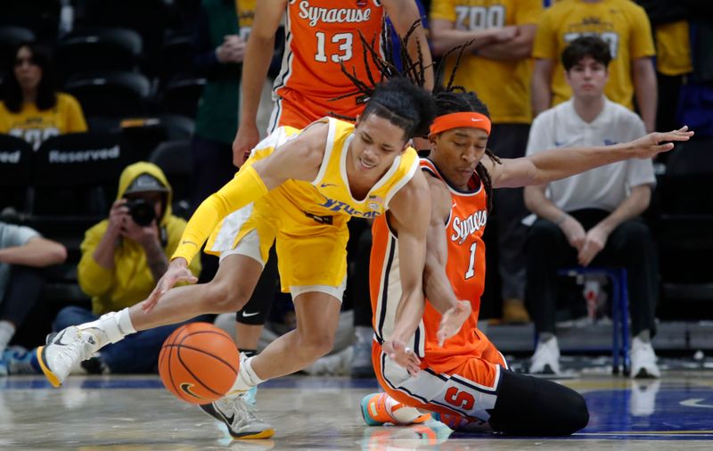 Jan 16, 2024; Pittsburgh, Pennsylvania, USA; Pittsburgh Panthers guard Jaland Lowe (left) avoids a steal attempt by Syracuse Orange forward Maliq Brown (1) during the second half at the Petersen Events Center. Syracuse won 69-58.Mandatory Credit: Charles LeClaire-USA TODAY Sports