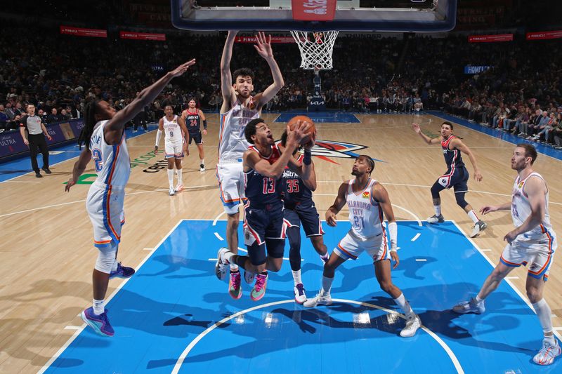 OKLAHOMA CITY, OK - FEBRUARY 23: Jordan Poole #13 of the Washington Wizards drives to the basket during the game against the Oklahoma City Thunder on February 23, 2024 at Paycom Arena in Oklahoma City, Oklahoma. NOTE TO USER: User expressly acknowledges and agrees that, by downloading and or using this photograph, User is consenting to the terms and conditions of the Getty Images License Agreement. Mandatory Copyright Notice: Copyright 2024 NBAE (Photo by Zach Beeker/NBAE via Getty Images)