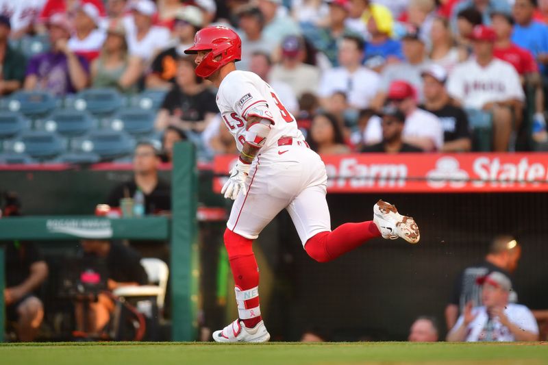 May 10, 2025; Anaheim, California, USA; Los Angeles Angels shortstop Zach Neto (9) runs after hitting a single against the Baltimore Orioles during the first inning at Angel Stadium. Mandatory Credit: Gary A. Vasquez-Imagn Images