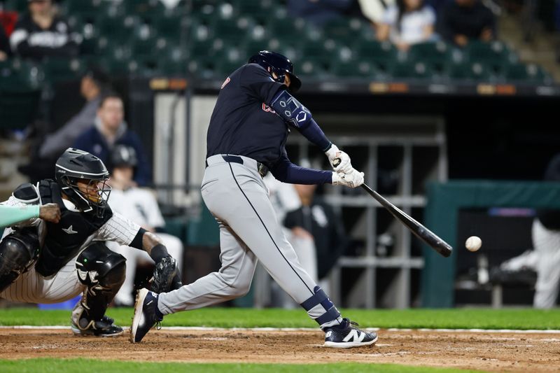 May 9, 2024; Chicago, Illinois, USA; Cleveland Guardians first baseman Kyle Manzardo (9) singles against the Chicago White Sox during the third inning at Guaranteed Rate Field. Mandatory Credit: Kamil Krzaczynski-USA TODAY Sports