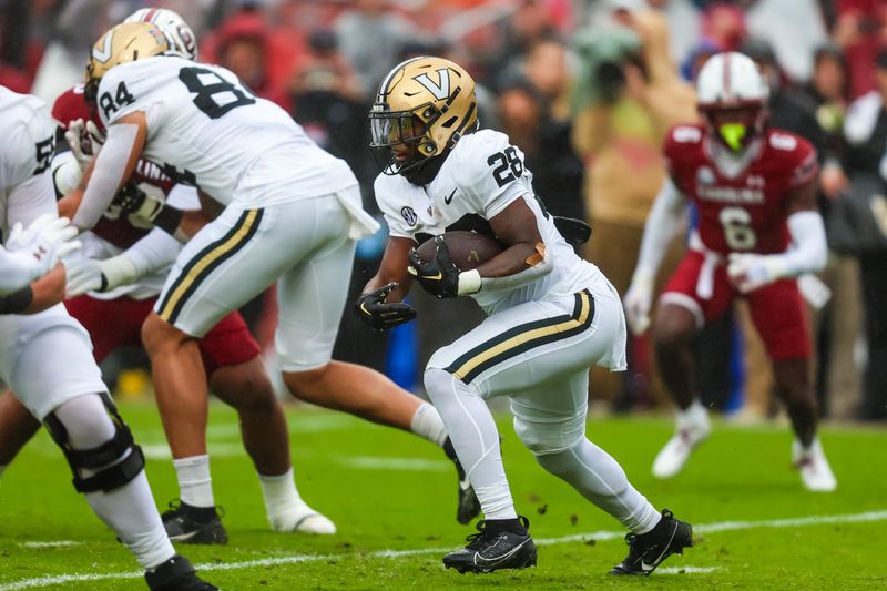 Nov 11, 2023; Columbia, South Carolina, USA; Vanderbilt Commodores running back Sedrick Alexander (28) runs the ball against the South Carolina Gamecocks in the first quarter at Williams-Brice Stadium. Mandatory Credit: Jeff Blake-USA TODAY Sports