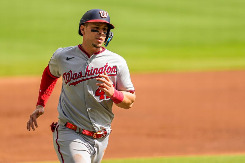 Oct 1, 2023; Cumberland, Georgia, USA; Washington Nationals first baseman Joey Meneses (45) scores a run against the Atlanta Braves during the first inning at Truist Park. Mandatory Credit: Dale Zanine-USA TODAY Sports