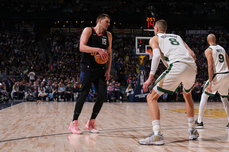 DENVER, CO - MARCH 7: Nikola Jokic #15 of the Denver Nuggets dribbles the ball during the game against the Boston Celtics on March 7, 2024 at the Ball Arena in Denver, Colorado. NOTE TO USER: User expressly acknowledges and agrees that, by downloading and/or using this Photograph, user is consenting to the terms and conditions of the Getty Images License Agreement. Mandatory Copyright Notice: Copyright 2024 NBAE (Photo by Bart Young/NBAE via Getty Images)