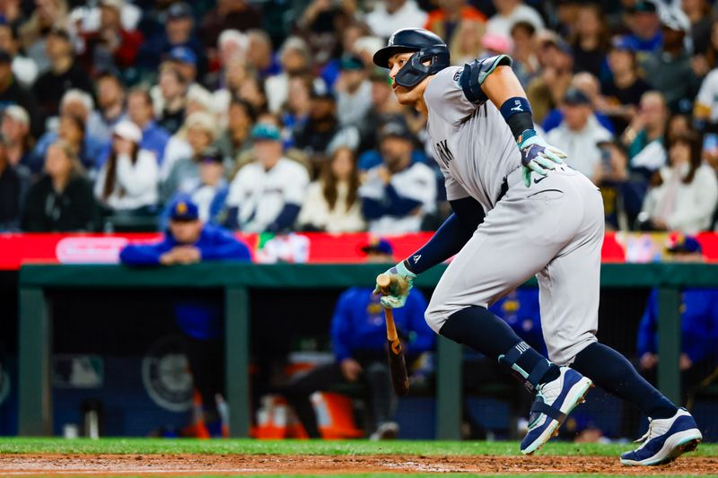 Sep 17, 2024; Seattle, Washington, USA; New York Yankees designated hitter Aaron Judge (99) hits a tow-run single against the Seattle Mariners during the second inning at T-Mobile Park. Mandatory Credit: Joe Nicholson-Imagn Images