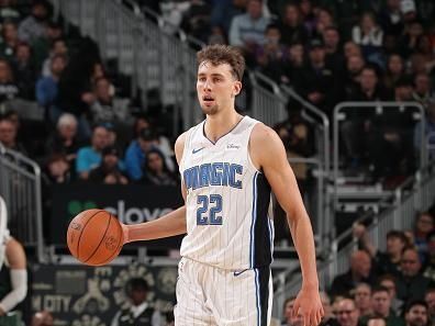 MILWAUKEE, WI - DECEMBER 21:  Franz Wagner #22 of the Orlando Magic handles the ball during the game against the Milwaukee Bucks on December 21, 2023 at the Fiserv Forum Center in Milwaukee, Wisconsin. NOTE TO USER: User expressly acknowledges and agrees that, by downloading and or using this Photograph, user is consenting to the terms and conditions of the Getty Images License Agreement. Mandatory Copyright Notice: Copyright 2023 NBAE (Photo by Gary Dineen/NBAE via Getty Images).