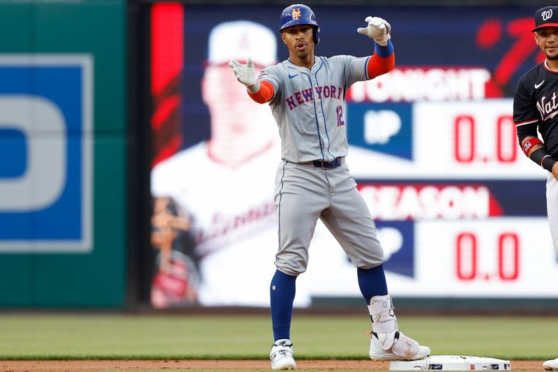 Jun 4, 2024; Washington, District of Columbia, USA; New York Mets shortstop Francisco Lindor (12) gestures to his dugout from second base after hitting a double against the Washington Nationals during the first inning at Nationals Park. Mandatory Credit: Geoff Burke-USA TODAY Sports