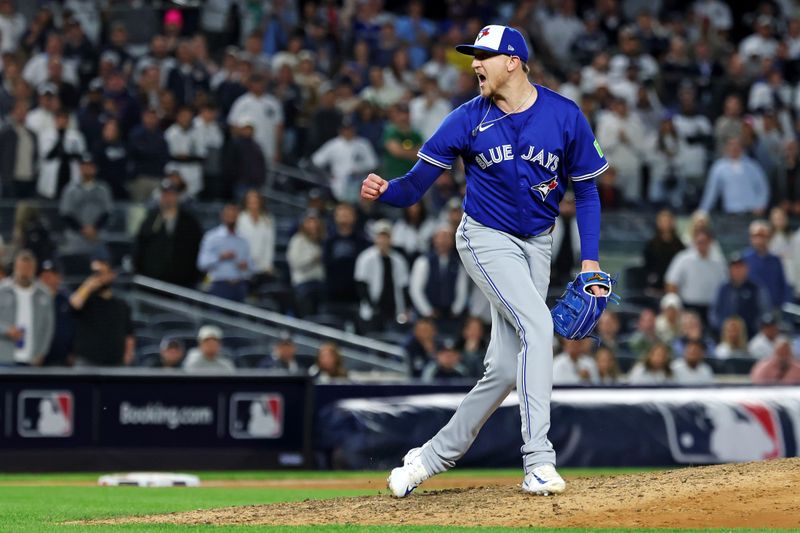 Oct 8, 2025; Bronx, New York, USA; Toronto Blue Jays pitcher Jeff Hoffman (23) celebrates getting the last out to win the ALDS round for the 2025 MLB playoffs against the New York Yankees at Yankee Stadium. Mandatory Credit: Vincent Carchietta-Imagn Images