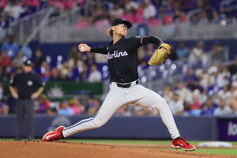 Aug 23, 2024; Miami, Florida, USA; Miami Marlins starting pitcher Max Meyer (23) delivers a pitch against the Chicago Cubs during the first inning at loanDepot Park. Mandatory Credit: Sam Navarro-USA TODAY Sports