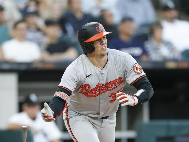 May 23, 2024; Chicago, Illinois, USA; Baltimore Orioles catcher Adley Rutschman (35) watches his RBI-single against the Chicago White Sox during the third inning at Guaranteed Rate Field. Mandatory Credit: Kamil Krzaczynski-USA TODAY Sports