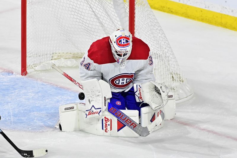 Nov 2, 2023; Tempe, Arizona, USA;  Montreal Canadiens goaltender Jake Allen (34) makes a save in the third period against the Arizona Coyotes at Mullett Arena. Mandatory Credit: Matt Kartozian-USA TODAY Sports