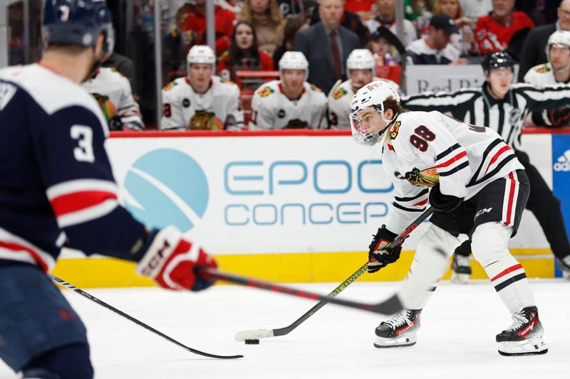 Mar 9, 2024; Washington, District of Columbia, USA; Chicago Blackhawks center Connor Bedard (98) prepares to shoot the puck as Washington Capitals defenseman Nick Jensen (3) looks on in the second period at Capital One Arena. Mandatory Credit: Geoff Burke-USA TODAY Sports