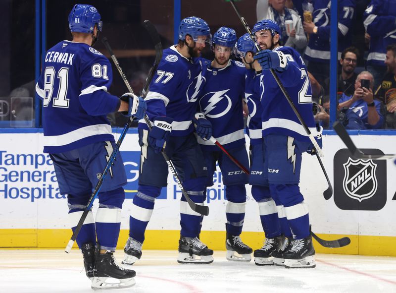 Oct 15, 2024; Tampa, Florida, USA; Tampa Bay Lightning center Anthony Cirelli (71) is congratulated after he scored a goal against the Vancouver Canucks during the third period at Amalie Arena. Mandatory Credit: Kim Klement Neitzel-Imagn Images