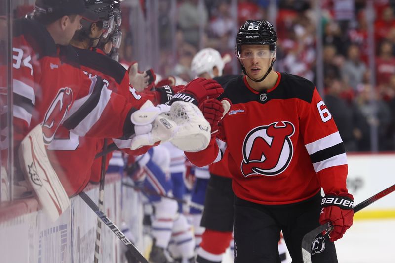 Nov 7, 2024; Newark, New Jersey, USA; New Jersey Devils left wing Jesper Bratt (63) celebrates his goal against the Montreal Canadiens during the first period at Prudential Center. Mandatory Credit: Ed Mulholland-Imagn Images