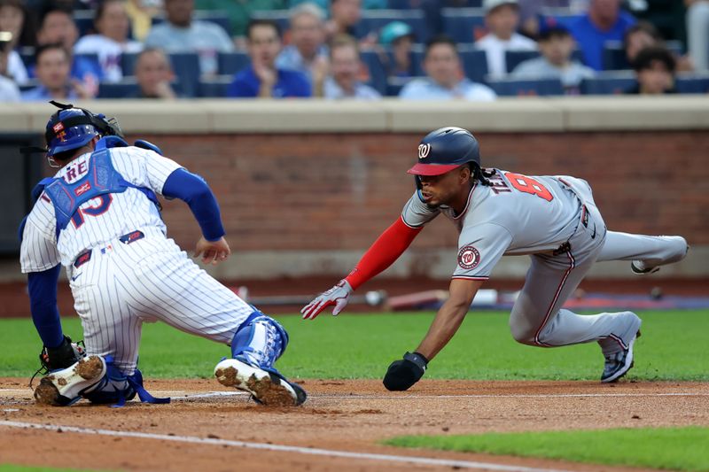 Jun 10, 2025; New York City, New York, USA; New York Mets catcher Luis Torrens (13) tags out Washington Nationals third baseman Jose Tena (8) trying to score on a double by shortstop CJ Abrams (not pictured) during the second inning at Citi Field. Mandatory Credit: Brad Penner-Imagn Images