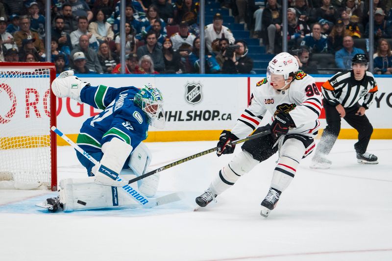Nov 5, 2025; Vancouver, British Columbia, CAN; Chicago Blackhawks forward Connor Bedard (98) shoots wide on Vancouver Canucks goalie Kevin Lankinen (32) in the first period at Rogers Arena. Mandatory Credit: Bob Frid-Imagn Images