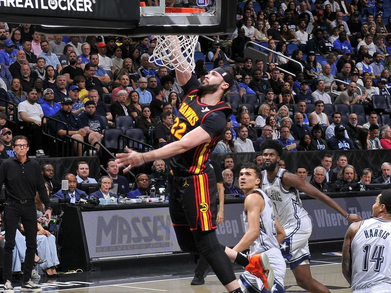 ORLANDO, FL - FEBRUARY 10: Larry Nance Jr. #22 of the Atlanta Hawks drives to the basket during the game against the Orlando Magic on February 10, 2025 at Kia Center in Orlando, Florida. NOTE TO USER: User expressly acknowledges and agrees that, by downloading and or using this photograph, User is consenting to the terms and conditions of the Getty Images License Agreement. Mandatory Copyright Notice: Copyright 2025 NBAE (Photo by Fernando Medina/NBAE via Getty Images)