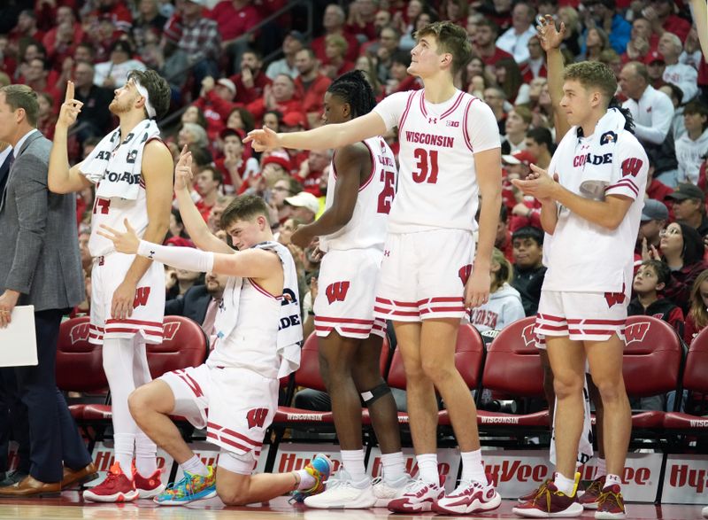 Jan 6, 2024; Madison, Wisconsin, USA; The Wisconsin Badgers bench reacts a three point basket scored by Wisconsin Badgers guard Max Klesmit (11) during the second half at the Kohl Center. Mandatory Credit: Kayla Wolf-USA TODAY Sports