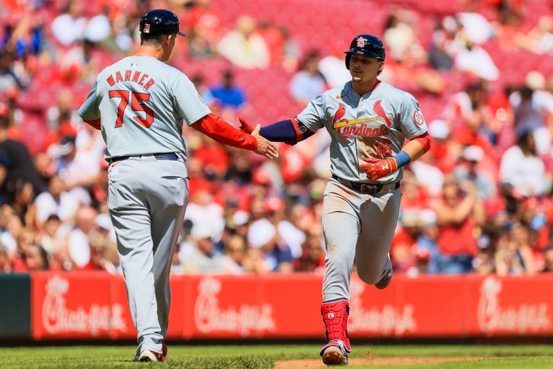 May 29, 2024; Cincinnati, Ohio, USA; St. Louis Cardinals second baseman Nolan Gorman (16) high fives third base coach Ron Warner (75) after hitting a solo home run in the eighth inning against the Cincinnati Reds at Great American Ball Park. Mandatory Credit: Katie Stratman-USA TODAY Sports