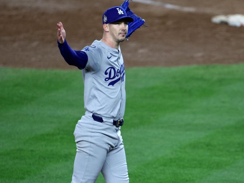 Oct 30, 2024; New York, New York, USA; Los Angeles Dodgers pitcher Walker Buehler (21) celebrates after winning the 2024 MLB World Series against the New York Yankees at Yankee Stadium. Mandatory Credit: Wendell Cruz-Imagn Images