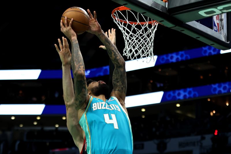 CHARLOTTE, NORTH CAROLINA - JANUARY 31: Nick Richards #4 of the Charlotte Hornets shoots the ball during the second half of an NBA game against the Chicago Bulls at Spectrum Center on January 31, 2024 in Charlotte, North Carolina. NOTE TO USER: User expressly acknowledges and agrees that, by downloading and or using this photograph, User is consenting to the terms and conditions of the Getty Images License Agreement. (Photo by David Jensen/Getty Images)