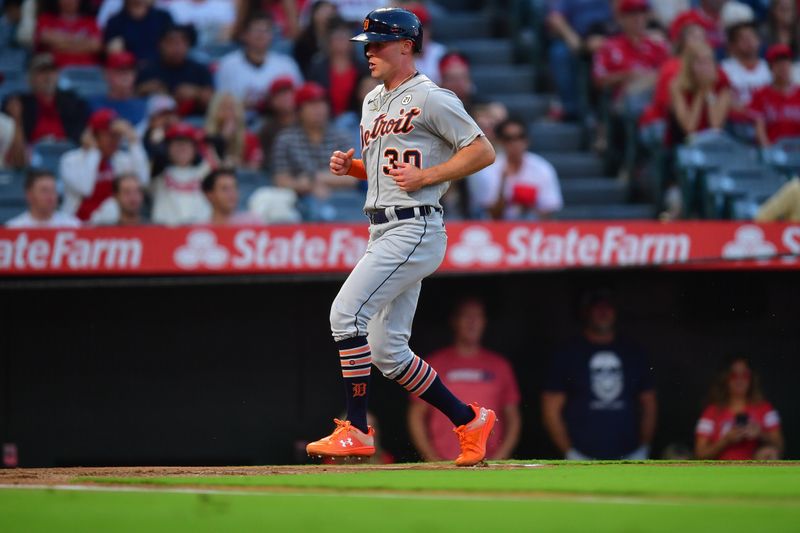 Sep 15, 2023; Anaheim, California, USA; Detroit Tigers right fielder Kerry Carpenter (30) scores a run against the Los Angeles Angels during the first inning at Angel Stadium. Mandatory Credit: Gary A. Vasquez-USA TODAY Sports