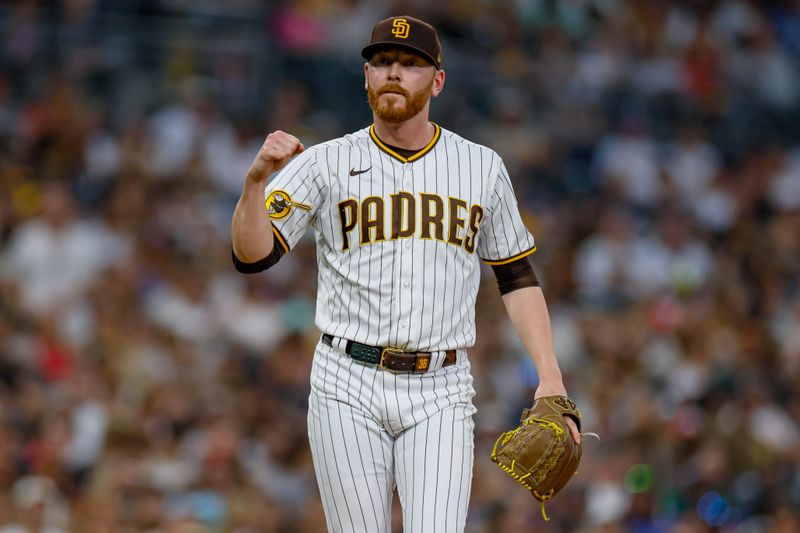 Jul 29, 2023; San Diego, California, USA; San Diego Padres relief pitcher Steven Wilson (36) celebrates as he walks to the dugout during the seventh inning against the Texas Rangers at Petco Park. Mandatory Credit: David Frerker-USA TODAY Sports