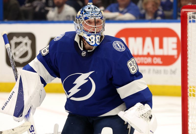 Apr 9, 2024; Tampa, Florida, USA; Tampa Bay Lightning goaltender Andrei Vasilevskiy (88) looks own against the Columbus Blue Jackets during the second period at Amalie Arena. Mandatory Credit: Kim Klement Neitzel-USA TODAY Sports