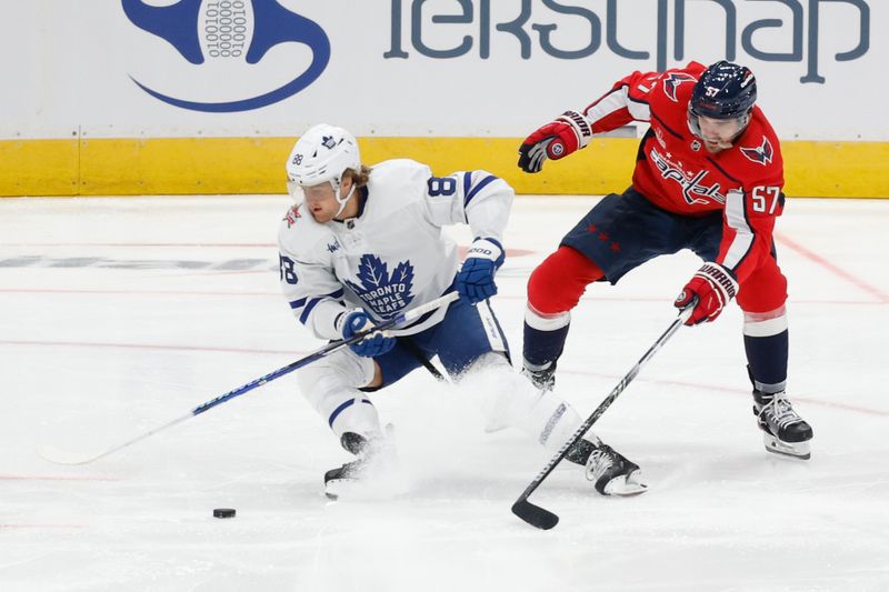 Oct 24, 2023; Washington, District of Columbia, USA; Toronto Maple Leafs right wing William Nylander (88) skates with the puck as Washington Capitals defenseman Trevor van Riemsdyk (57) defends in the first period at Capital One Arena. Mandatory Credit: Geoff Burke-USA TODAY Sports