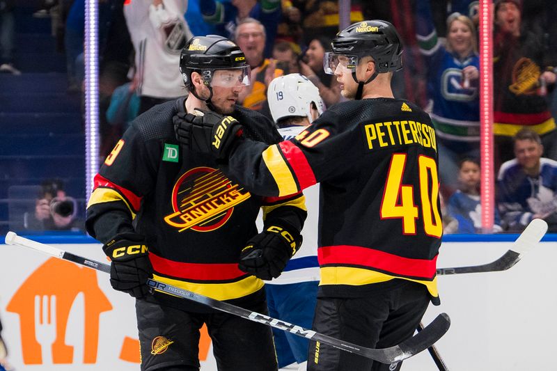 Jan 20, 2024; Vancouver, British Columbia, CAN; Vancouver Canucks forward J.T. Miller (9) and forward Elias Pettersson (40) celebrate Miller   s goal against the Toronto Maple Leafs in the third period at Rogers Arena. Canucks won 6-4. Mandatory Credit: Bob Frid-USA TODAY Sports