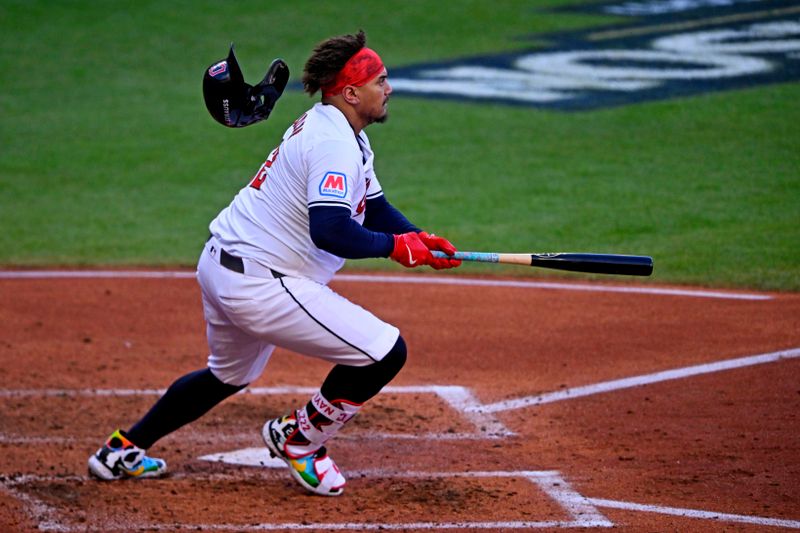 Oct 7, 2024; Cleveland, Ohio, USA; Cleveland Guardians first base Josh Naylor (22) hits a double during the fifth inning against the Detroit Tigers during game two of the ALDS for the 2024 MLB Playoffs at Progressive Field. Mandatory Credit: David Richard-Imagn Images