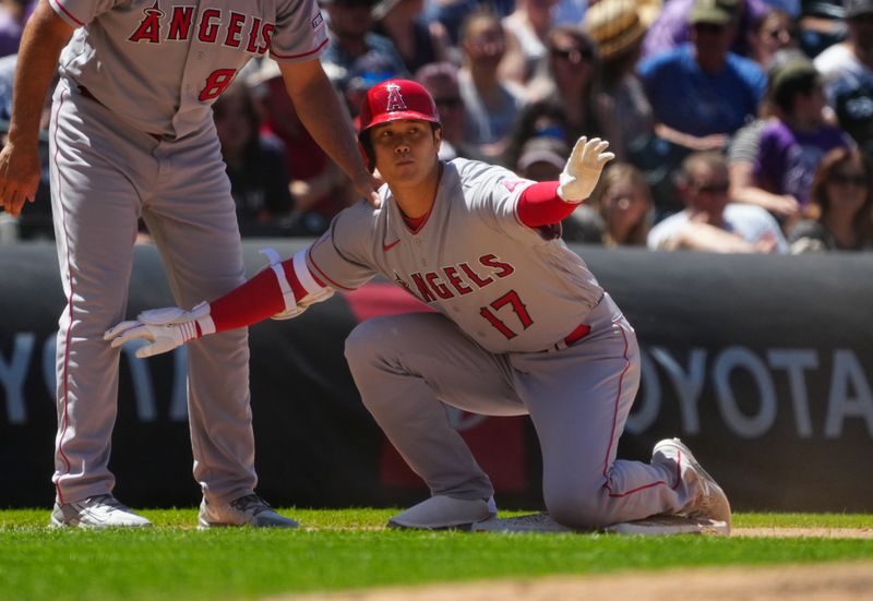 Jun 25, 2023; Denver, Colorado, USA; Los Angeles Angels starting pitcher Shohei Ohtani (17) reacts after his triple in the sixth inning against the Colorado Rockies at Coors Field. Mandatory Credit: Ron Chenoy-USA TODAY Sports