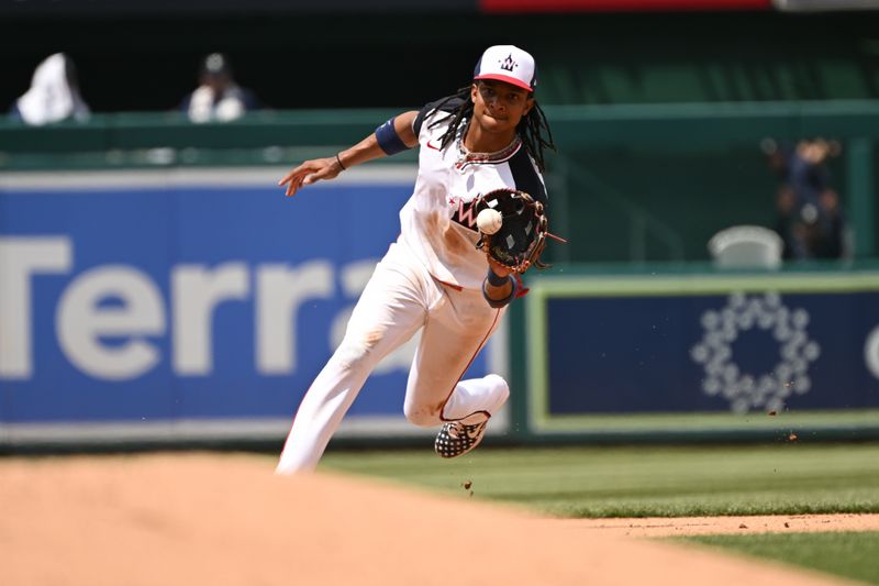 May 26, 2024; Washington, District of Columbia, USA; Washington Nationals shortstop CJ Abrams (5) fields a ground ball against the Seattle Mariners during the fourth inning at Nationals Park. Mandatory Credit: Rafael Suanes-USA TODAY Sports