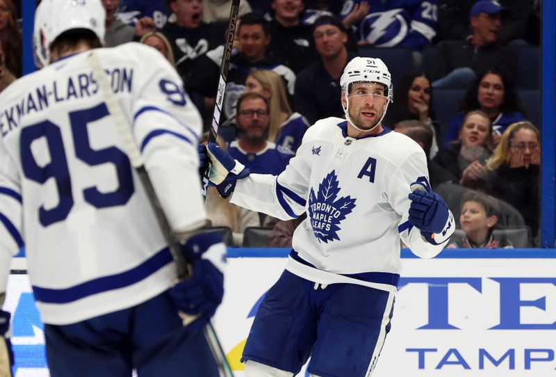 Nov 30, 2024; Tampa, Florida, USA; Toronto Maple Leafs center John Tavares (91) celebrates after he scored a goal against the Tampa Bay Lightning during the second period at Amalie Arena. Mandatory Credit: Kim Klement Neitzel-Imagn Images