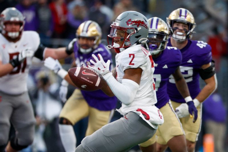 Nov 25, 2023; Seattle, Washington, USA; Washington State Cougars wide receiver Kyle Williams (2) drops a pass against the Washington Huskies during the fourth quarter at Alaska Airlines Field at Husky Stadium. Mandatory Credit: Joe Nicholson-USA TODAY Sports