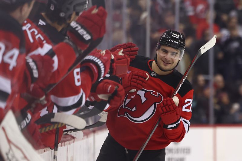 Dec 6, 2024; Newark, New Jersey, USA; New Jersey Devils right wing Timo Meier (28) celebrates his goal against the Seattle Kraken during the third period at Prudential Center. Mandatory Credit: Ed Mulholland-Imagn Images