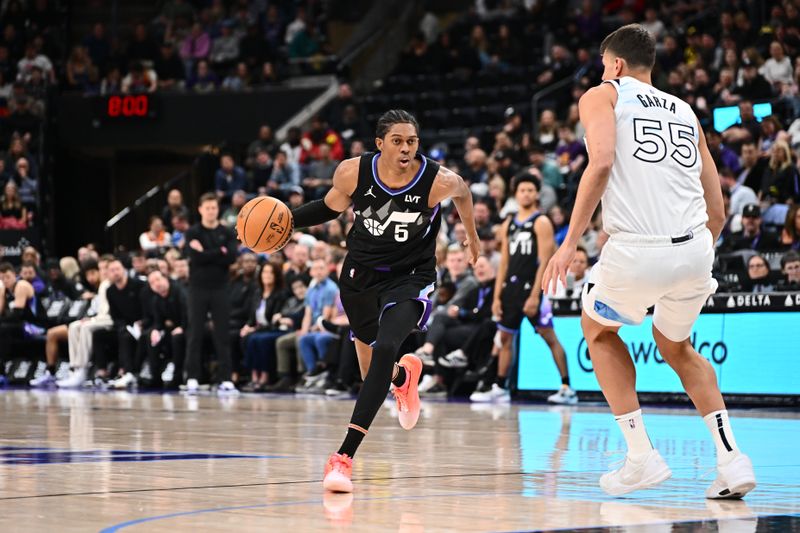 SALT LAKE CITY, UT - FEBRUARY 28:  Cody Williams #5 of the Utah Jazz dribbles the ball during the game against the Minnesota Timberwolves on February 28, 2025 at Delta Center in Salt Lake City, Utah. NOTE TO USER: User expressly acknowledges and agrees that, by downloading and or using this Photograph, User is consenting to the terms and conditions of the Getty Images License Agreement. Mandatory Copyright Notice: Copyright 2025 NBAE (Photo by Jamie Sabau/NBAE via Getty Images)