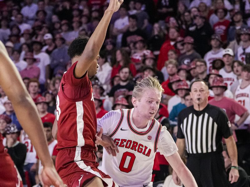 Jan 31, 2024; Athens, Georgia, USA; Georgia Bulldogs guard Blue Cain (0) dribbles against the Alabama Crimson Tide during the first half at Stegeman Coliseum. Mandatory Credit: Dale Zanine-USA TODAY Sports