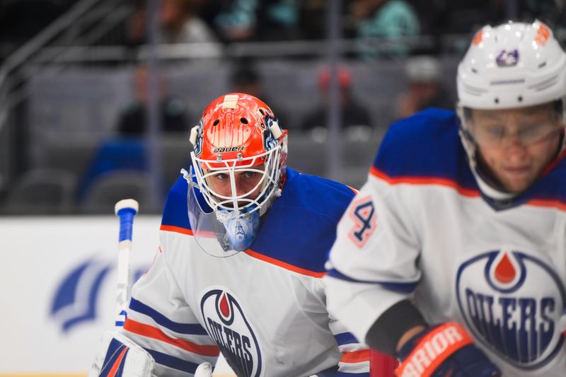 Oct 2, 2024; Seattle, Washington, USA; Edmonton Oilers goaltender Olivier Rodrigue (35) defends the goal during the third period against the Seattle Kraken at Climate Pledge Arena. Mandatory Credit: Steven Bisig-Imagn Images