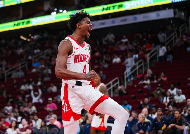 HOUSTON, TEXAS - OCTOBER 10: Jalen Green #4 of the Houston Rockets reacts after a dunk in the third quarter of the preseason game against the Indiana Pacers at Toyota Center on October 10, 2023 in Houston, Texas. NOTE TO USER: User expressly acknowledges and agrees that, by downloading and or using this photograph, User is consenting to the terms and conditions of the Getty Images License Agreement. (Photo by Alex Bierens de Haan/Getty Images)