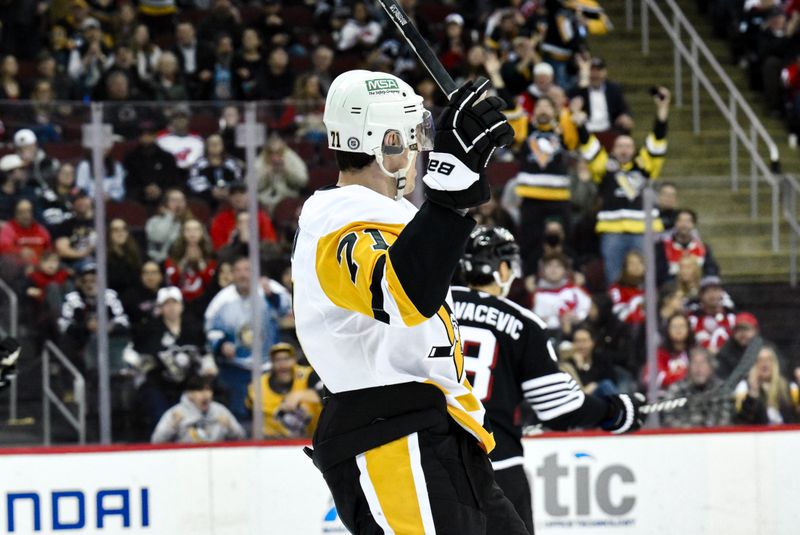 Apr 11, 2025; Newark, New Jersey, USA; Pittsburgh Penguins center Evgeni Malkin (71) reacts after scoring a goal against the New Jersey Devils during the first period at Prudential Center. Mandatory Credit: John Jones-Imagn Images