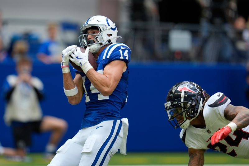 Indianapolis Colts wide receiver Alec Pierce (14) makes a touchdown reception during the first half of an NFL football game against the Houston Texans, Sunday, Sept. 8, 2024, in Indianapolis. (AP Photo/Michael Conroy)