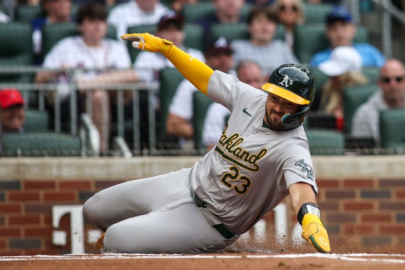 Jun 1, 2024; Atlanta, Georgia, USA; Oakland Athletics catcher Shea Langeliers (23) scores a run against the Atlanta Braves in the first inning at Truist Park. Mandatory Credit: Brett Davis-USA TODAY Sports