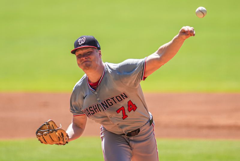 Aug 25, 2024; Cumberland, Georgia, USA; Washington Nationals starting pitcher DJ Herz (74) pitches against the Atlanta Braves during the first inning at Truist Park. Mandatory Credit: Dale Zanine-USA TODAY Sports