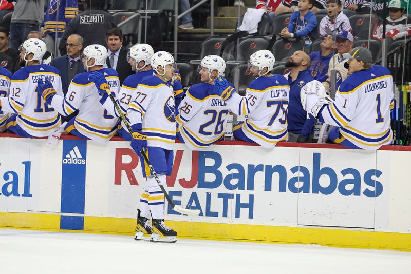 Oct 27, 2023; Newark, New Jersey, USA; Buffalo Sabres right wing JJ Peterka (77) celebrates his goal with teammates during the first period against the New Jersey Devils at Prudential Center. Mandatory Credit: Vincent Carchietta-USA TODAY Sports