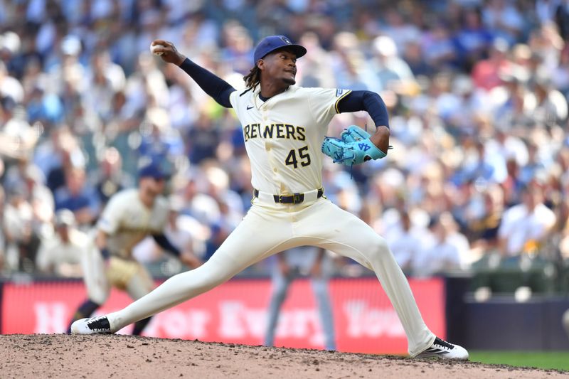 Jul 9, 2025; Milwaukee, Wisconsin, USA; Milwaukee Brewers pitcher Abner Uribe (45) pitches during the ninth inning against the Los Angeles Dodgers at American Family Field. Mandatory Credit: Patrick Gorski-Imagn Images